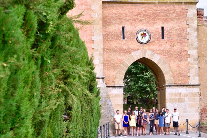 Food tour guests in front of Castle in Bolgheri