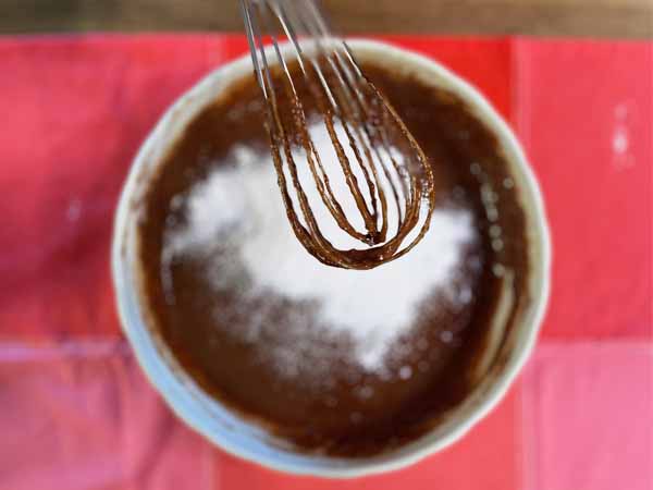 almond flour chocolate cake batter and whisk