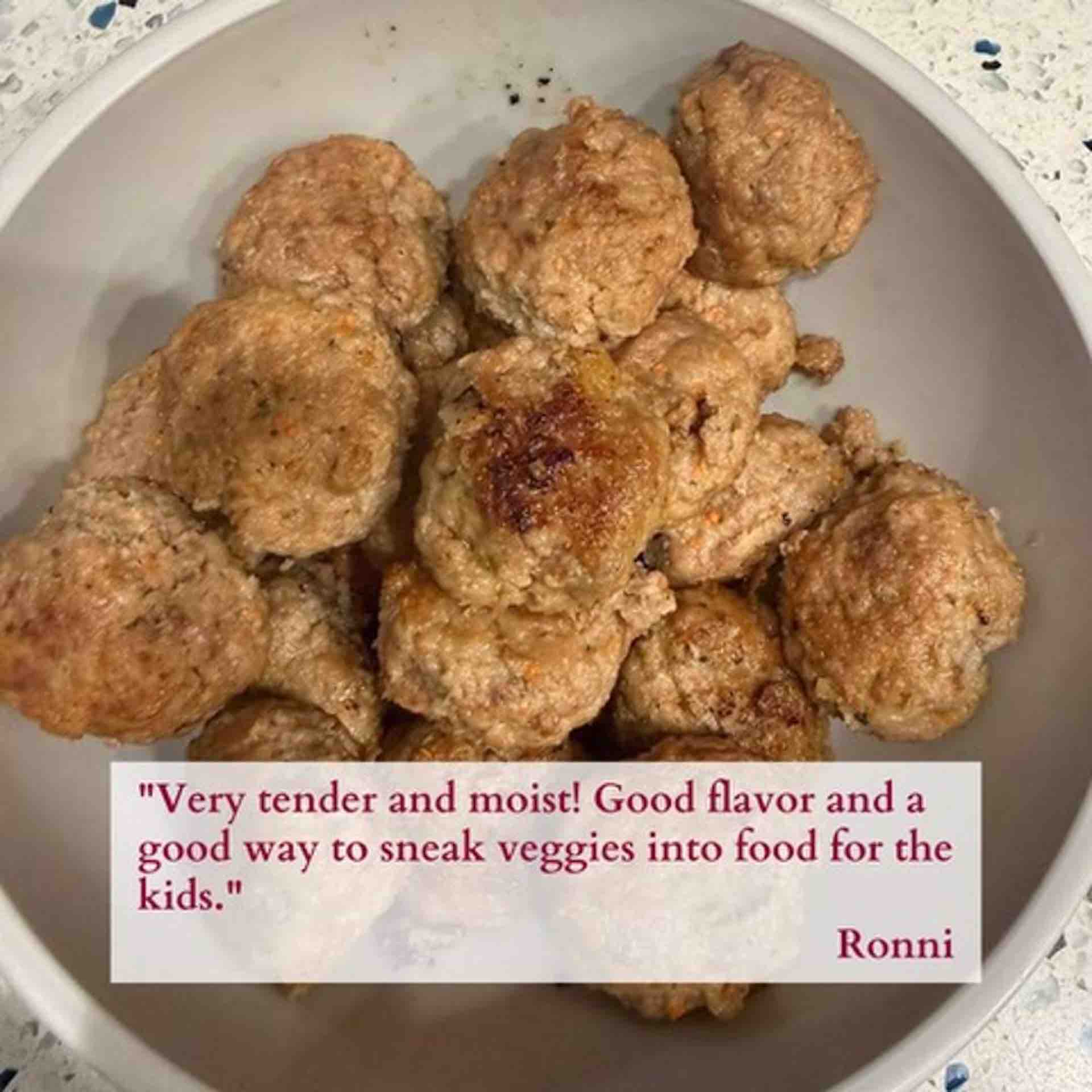 Homemade Italian meatballs served in a bowl tender and golden brown